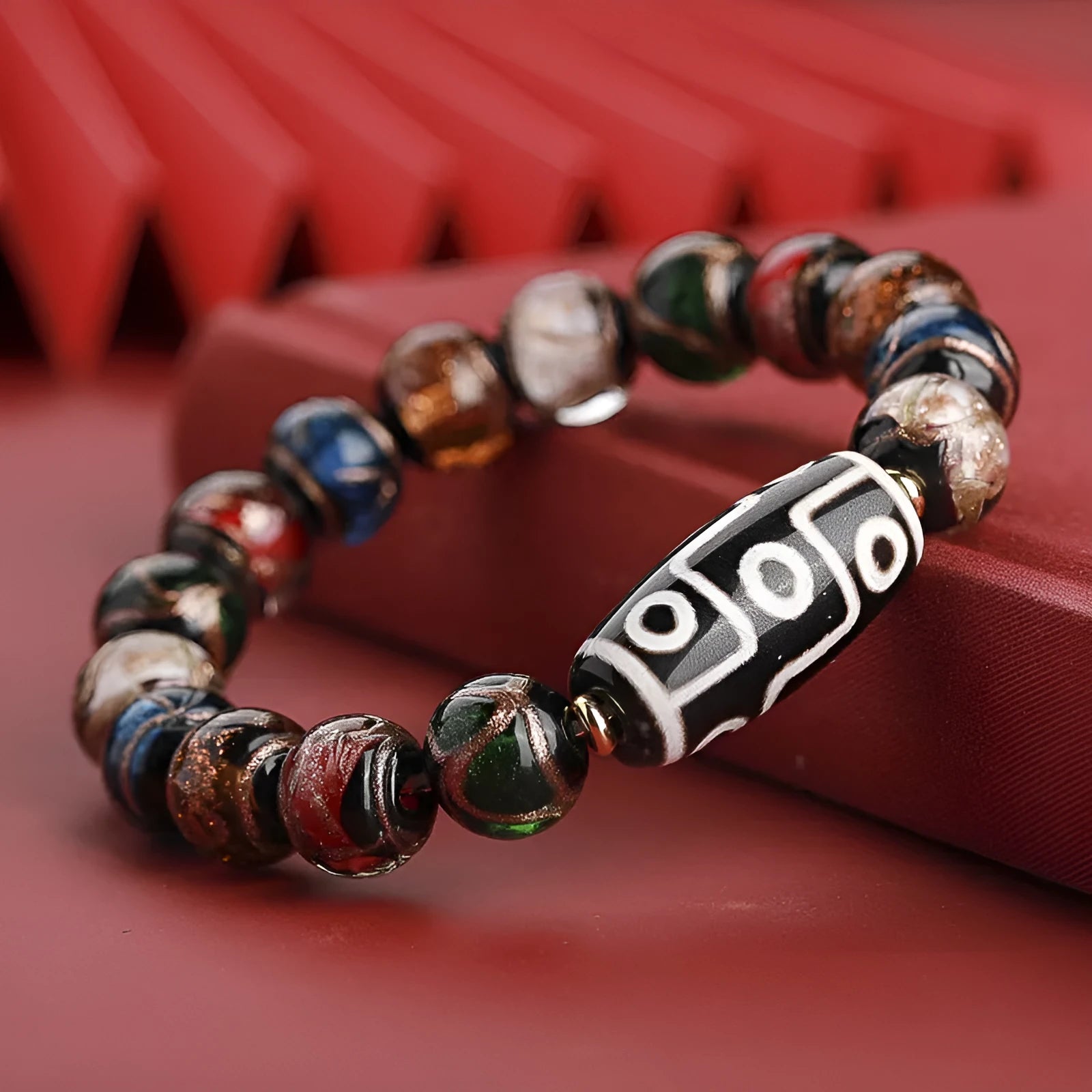 Chinese style bracelet with coloured glaze beads featuring snake patterns in 10mm, 12mm, and 14mm sizes