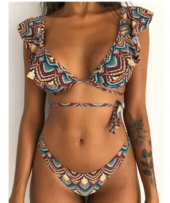 Yellow floral print split bikini swimsuit on a hanger, showing top and briefs.