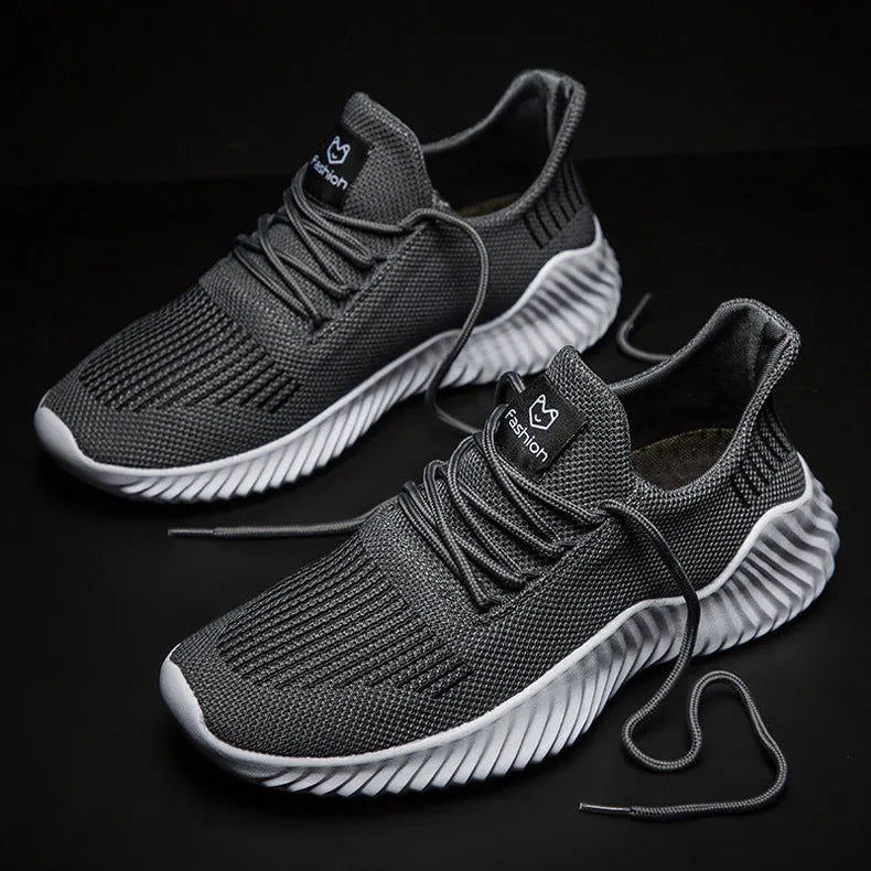 Men's breathable ultra-light running shoes with white upper and grey sole, side view