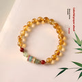 Yellow citrine prayer wheel bracelet with 8mm round beads and adjustable fastening