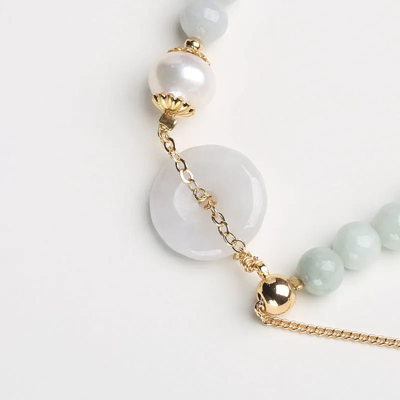 Jade bracelet with emerald peace buckle charm and pearl pendant in geometric national style design
