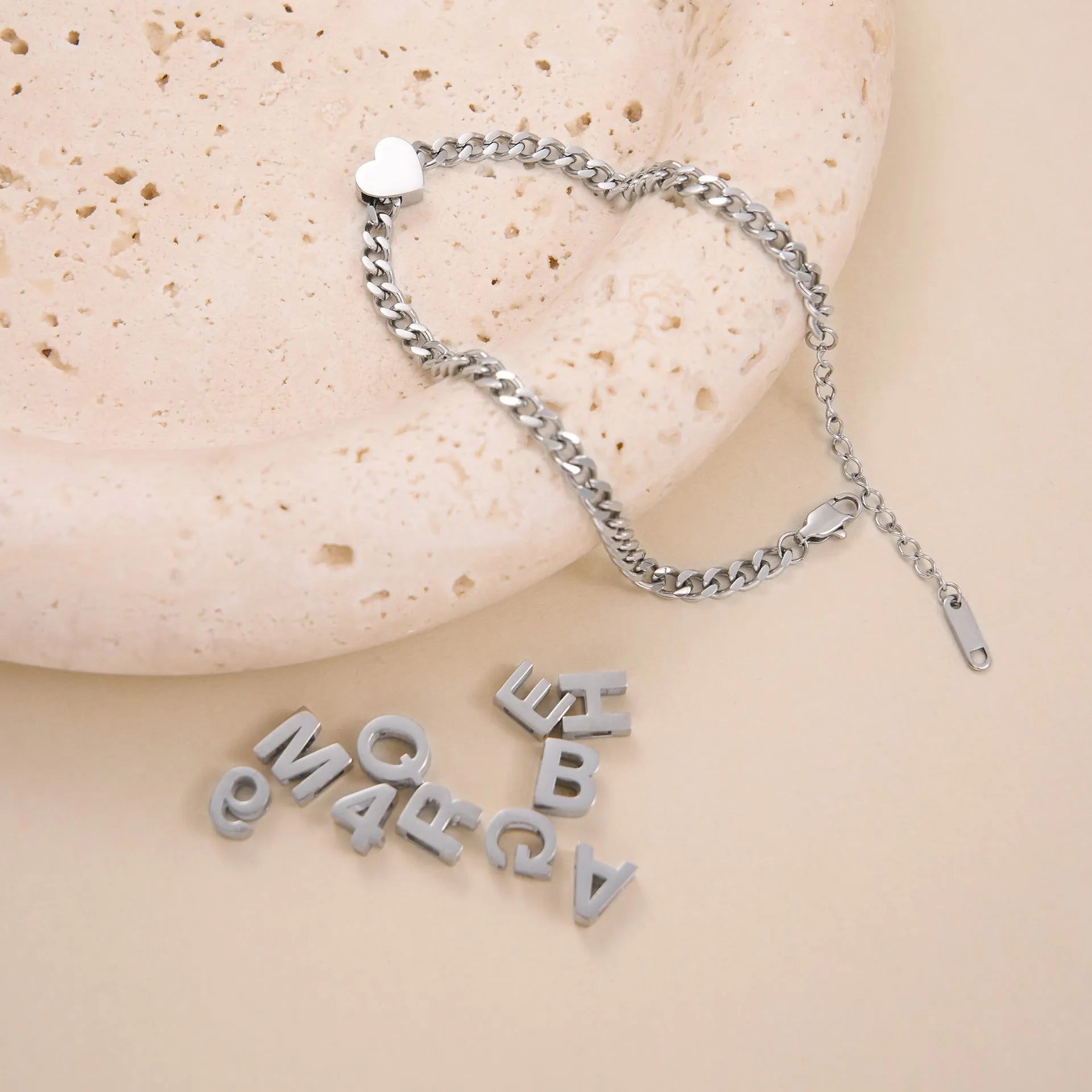 Gold titanium steel necklace with a letter A pendant on a blade chain.