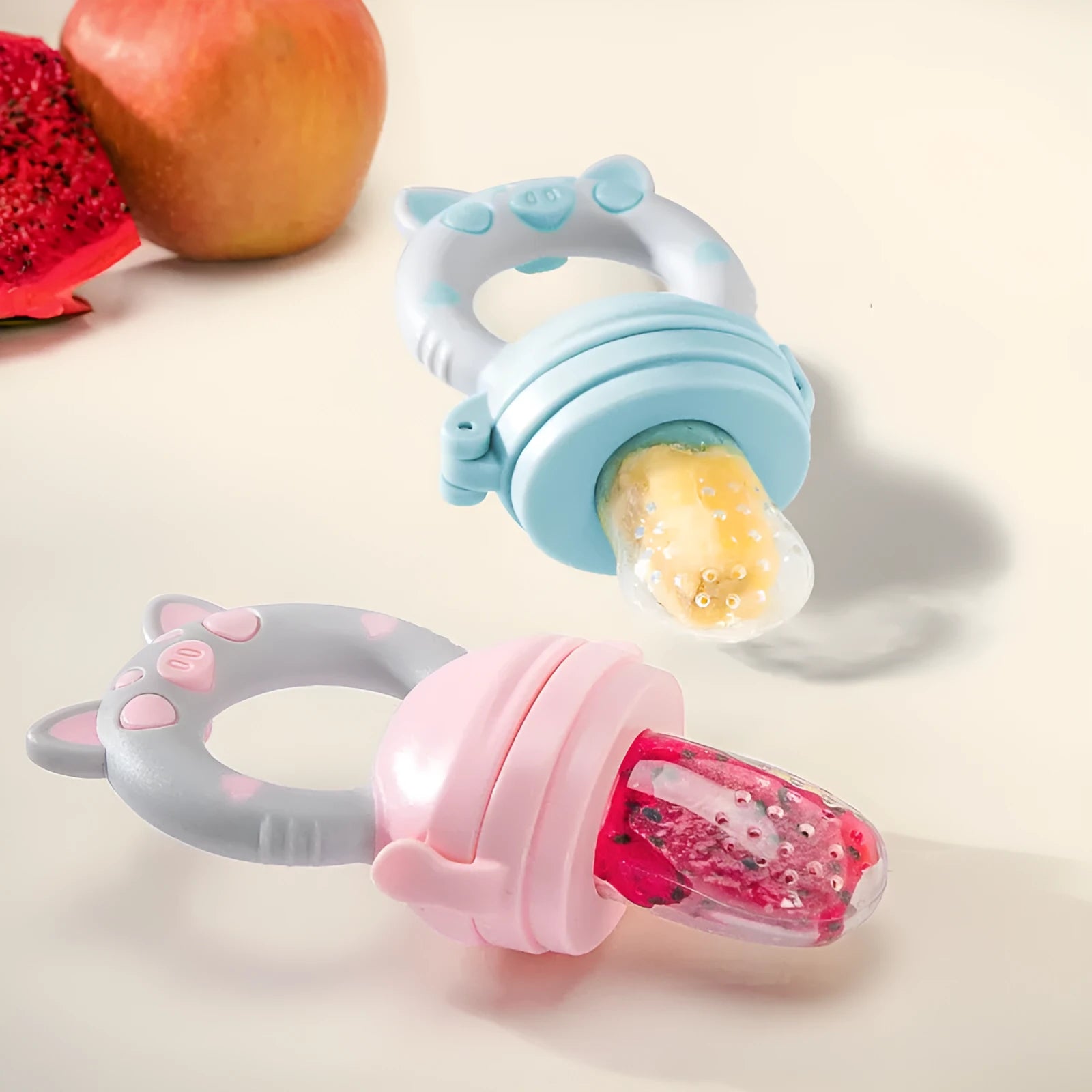 Silicone baby teether with textured surface and ring shape in blue, green or pink colours
