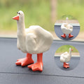 Creative middle finger duck cartoon resin ornament in beige, 50x77mm, on car centre console