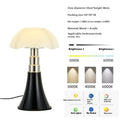 Italian retro flower design table lamp in a choice of colours on a bedside table.