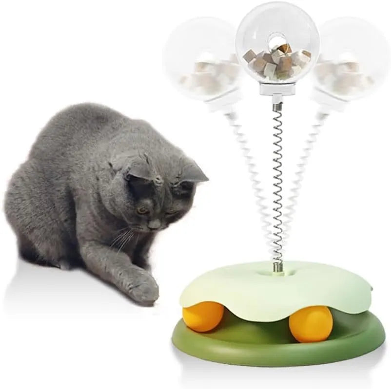 Blue and green cat treat dispenser toy with track ball for slow feeding and play