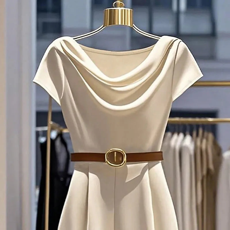 Apricot satin wide-leg jumpsuit with mid-waist and quarter sleeves on a model