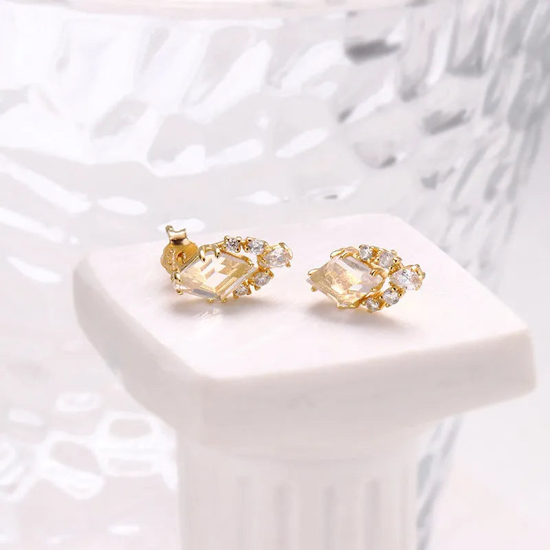 Geometric silver earrings with natural white crystal studs
