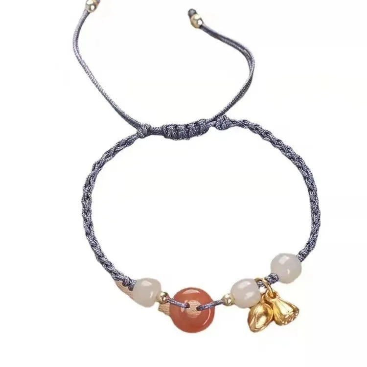 Hetian Jade Peace Buckle Two Shihuan Bracelet with brown leather strap showing constellation detail.