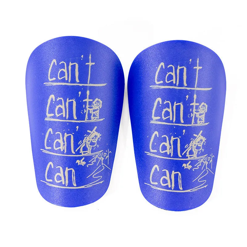 Pair of PU football shin guards in black, shown on a leg, for training and sports protection.
