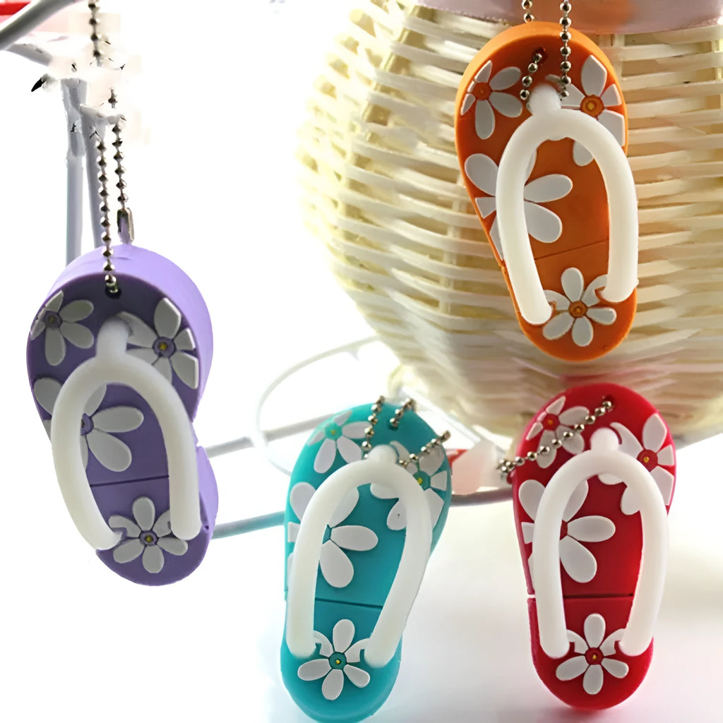 Colourful silicone beach shoe shaped USB flash drive on a white background.