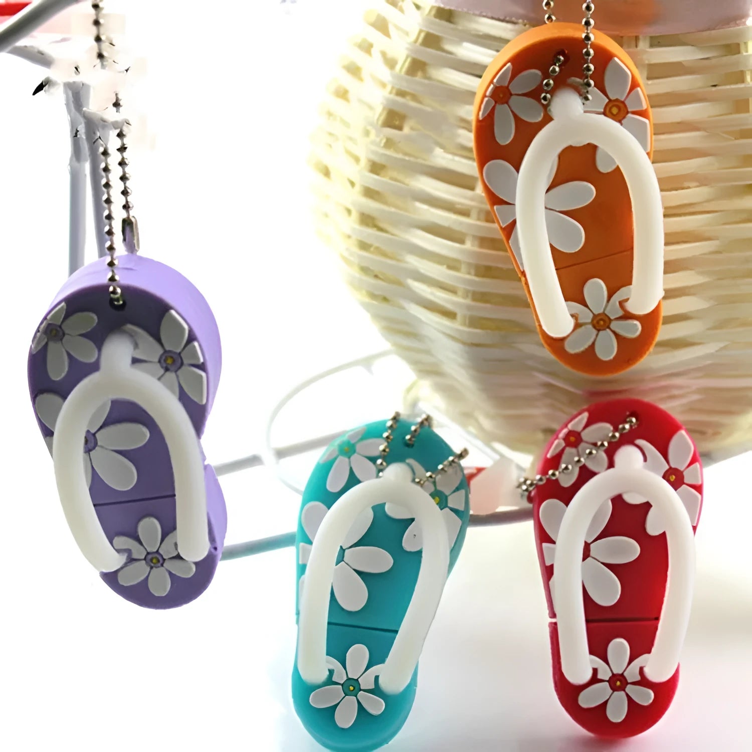 Colourful silicone beach shoe shaped USB flash drive on a white background.