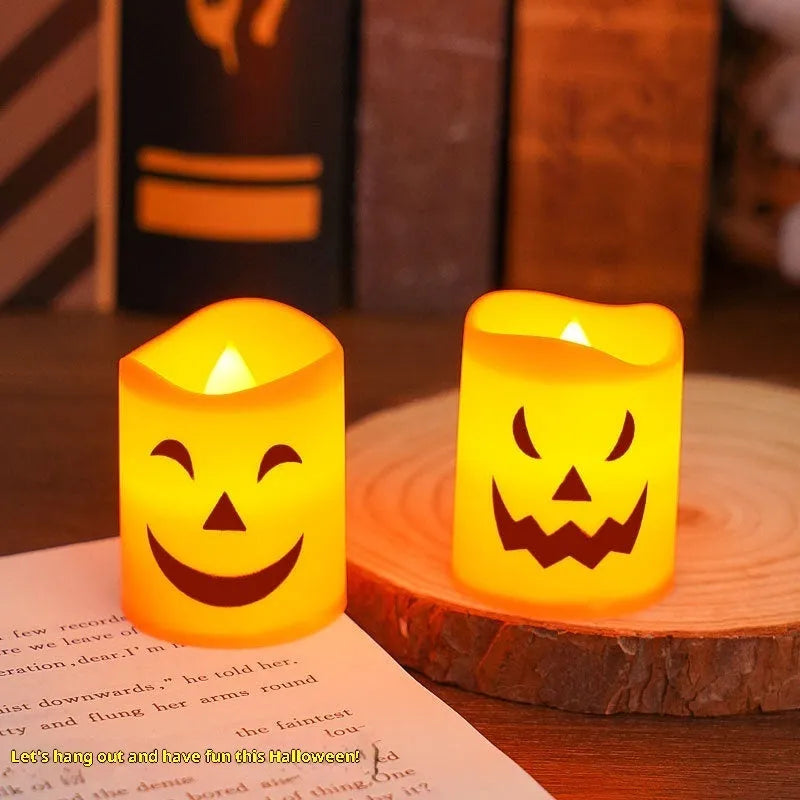 Set of six pumpkin-coloured plastic electric candle lamps arranged for Halloween decoration