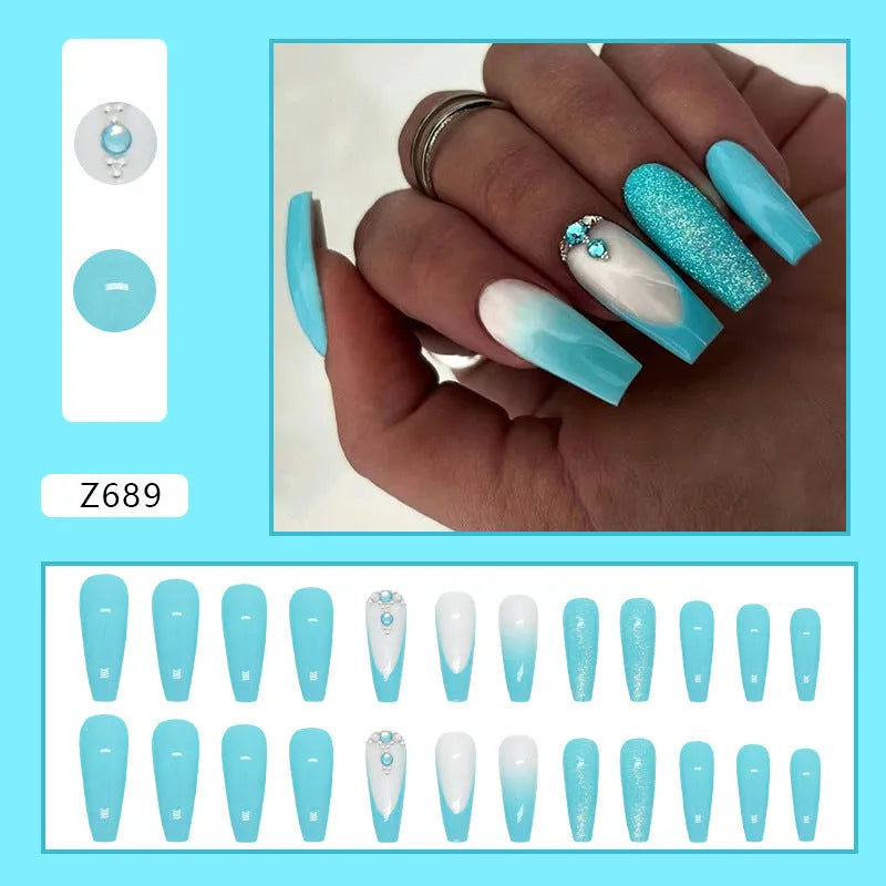 Long ballet-shaped false nails with blue diamond glitter, includes glue.