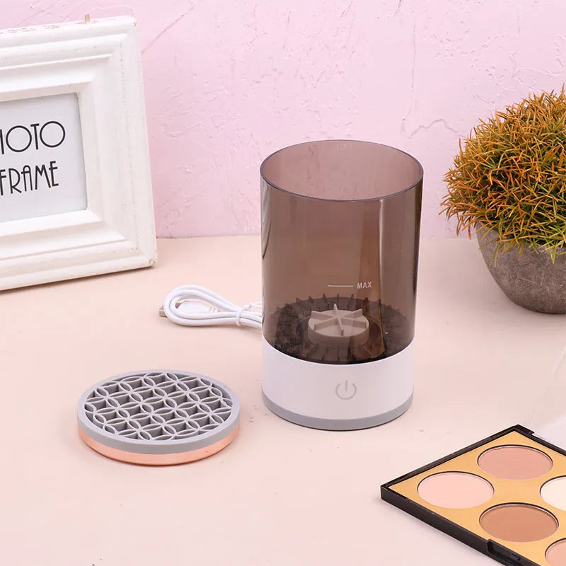 Grey and white portable electric makeup brush cleaner with USB charging cable