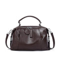 First layer cowhide leather one-shoulder messenger bag in brown with visible sewing thread and pillow shape