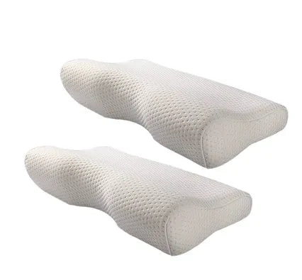Blue butterfly-shaped memory foam cervical pillow on a bed.
