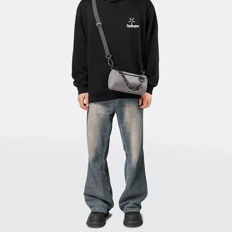 Black casual Oxford cloth messenger bag with a chain strap, shown closed.