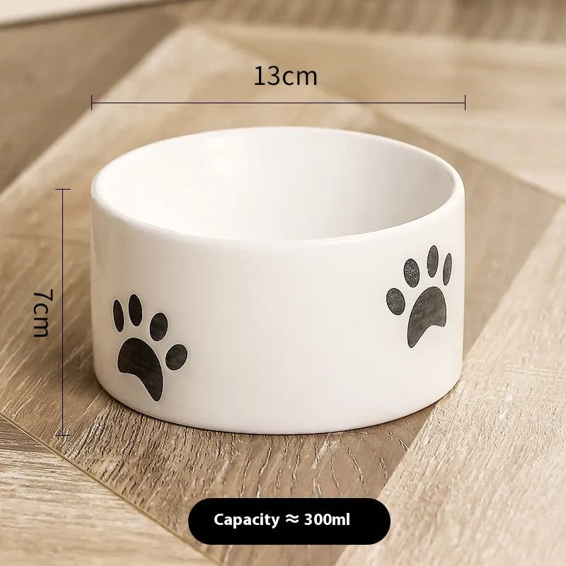 Ceramic cat bowl with oblique mouth and high foot in cat's paw black colour