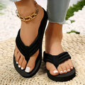Black women's cotton slippers with ribbon trim and a textured non-slip EVA sole.