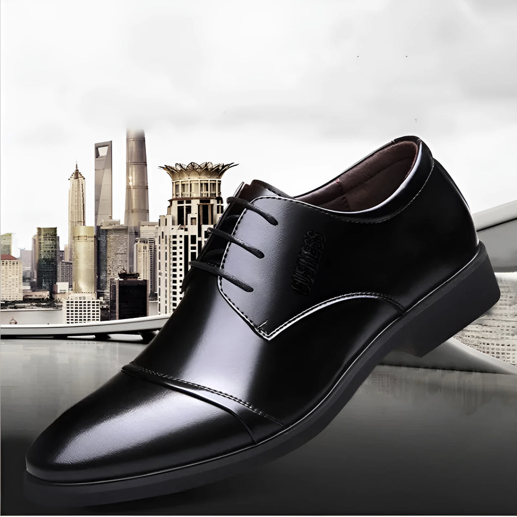 Men's black leather lace-up ankle boot with stitching detail and rubber sole