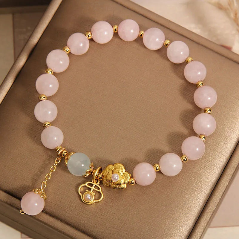 Women's pink crystal flower bracelet with adjustable fit on wrist