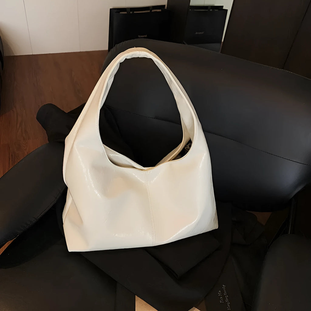 One shoulder tote bag in cream yellow with square vertical shape, outer slit pocket, internal phone bag, PU outer and polyester lining