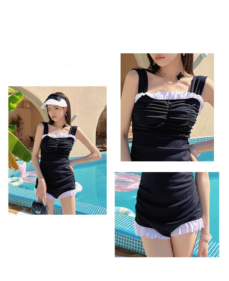 Women's black suspender-style one-piece swimsuit in polyester fabric