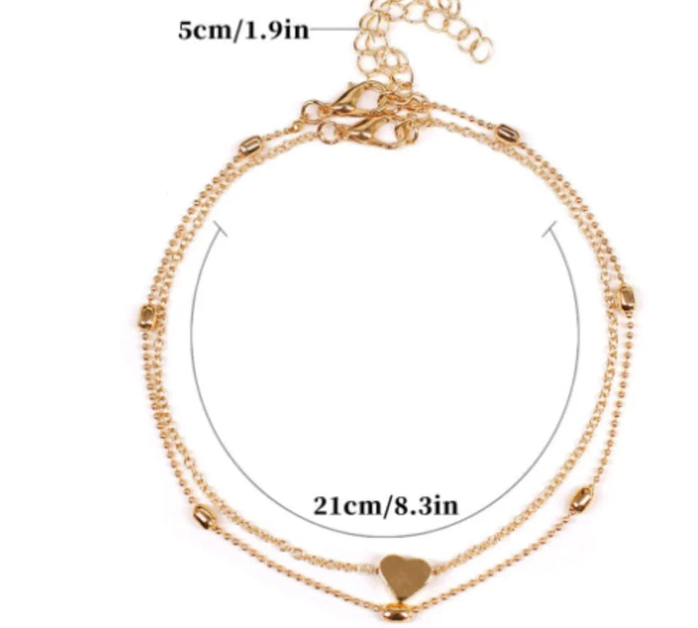 Double-layered heart-shaped anklet with retro beach-inspired chain in gold and silver colors