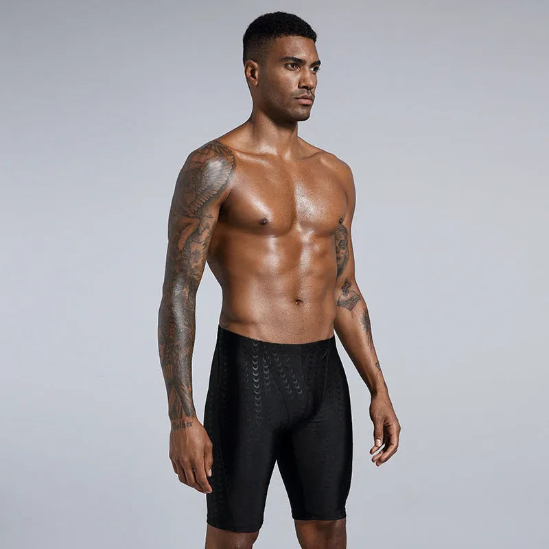 Men's solid colour shark skin texture waterproof swimming trunks for surfing, shown in sizes XL to 4XL.