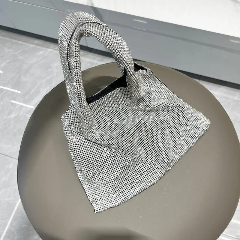 Silver handbag with shiny rhinestone decoration and open pocket design