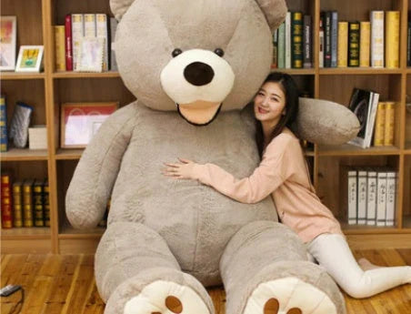 A plush, giant teddy bear with realistic facial features and a soft, huggable design