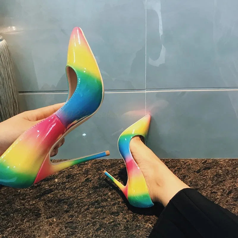 Rainbow patent leather pointed toe stiletto high heel shoe with thin heel.