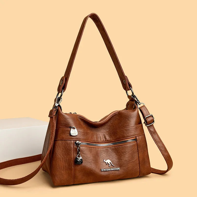 Genuine leather double-sided kangaroo crossbody bag in black with belt decoration and soft sheepskin finish.
