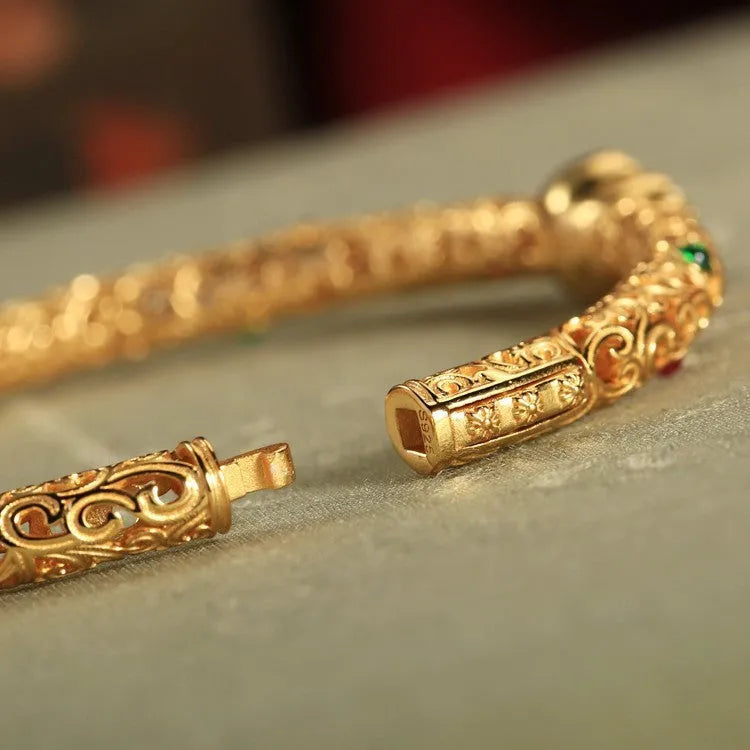 Gold-plated women's open cuff bracelet with xiangyun gourd charm on copper electroplated construction