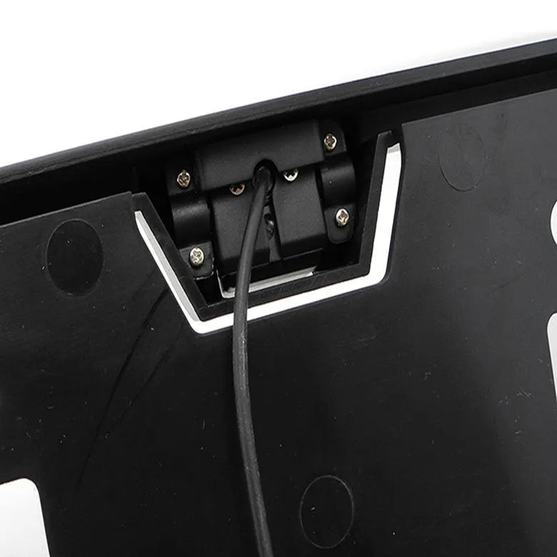 Black ABS license plate frame model HR-217A measuring 57x14x4.5mm