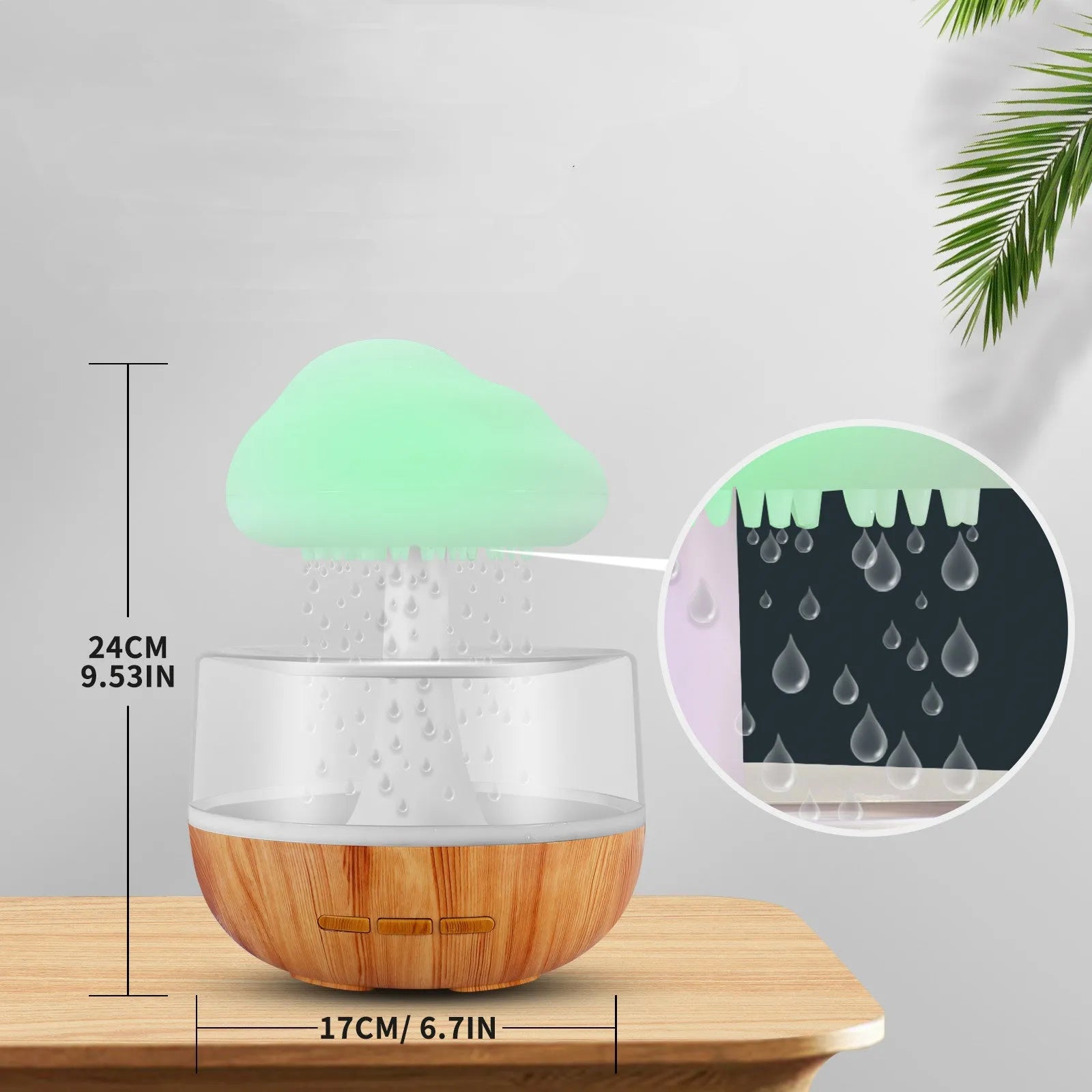 White cloud-shaped humidifier with LED night light and water droplet effect on a table.
