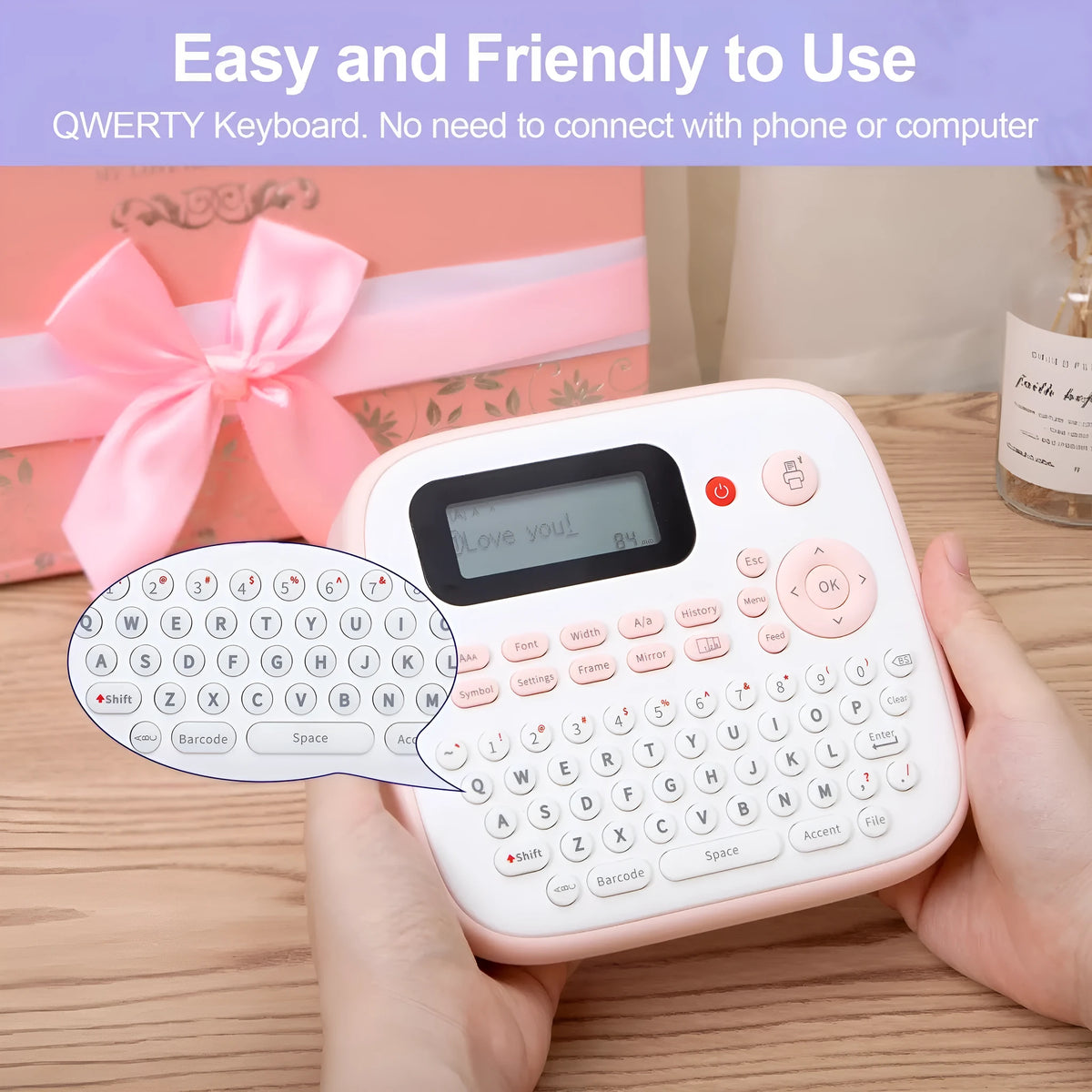 Mini portable label printer in pink or yellow with JM-231 black on white label tape, AC adapter, and replacement cutter holder