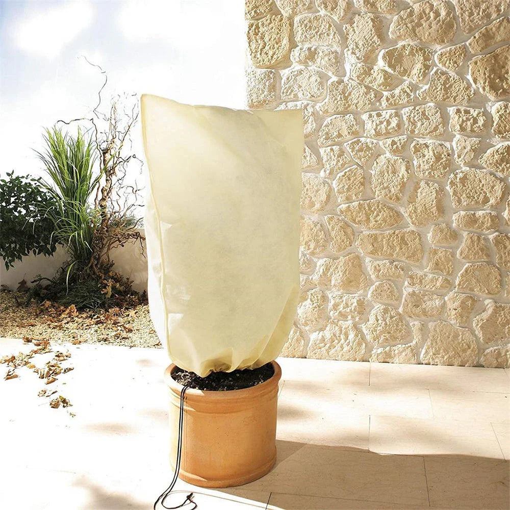 Adjustable, breathable plant cover in beige fabric to protect outdoor plants from winter frost and harsh weather