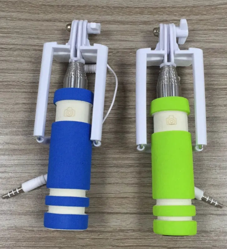 Folding selfie stick for cell phones shown in black, blue, green, orange, and pink