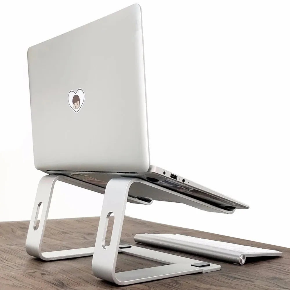 Aluminium alloy notebook cooling bracket in black on a desk with a laptop placed on it