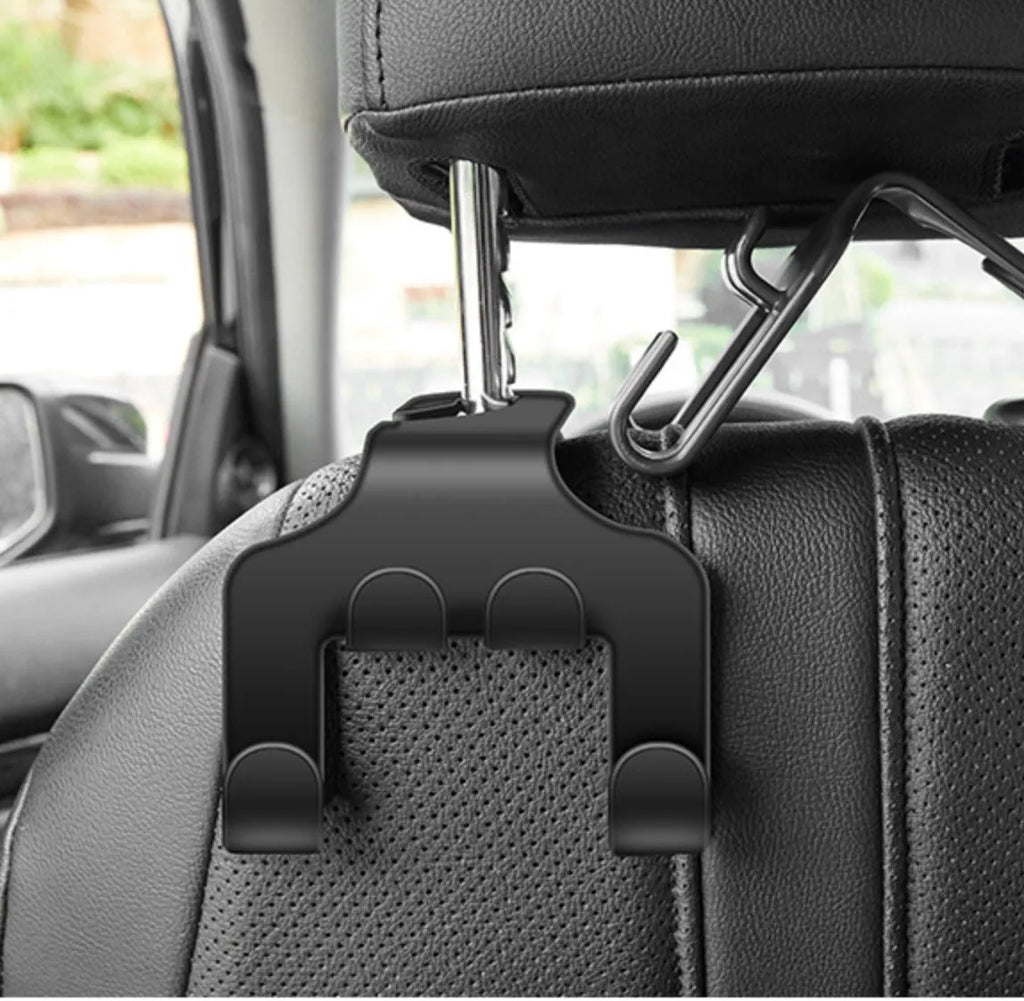 Two white ABS car-mounted multifunction hooks showing phone bracket and hanging hook uses.