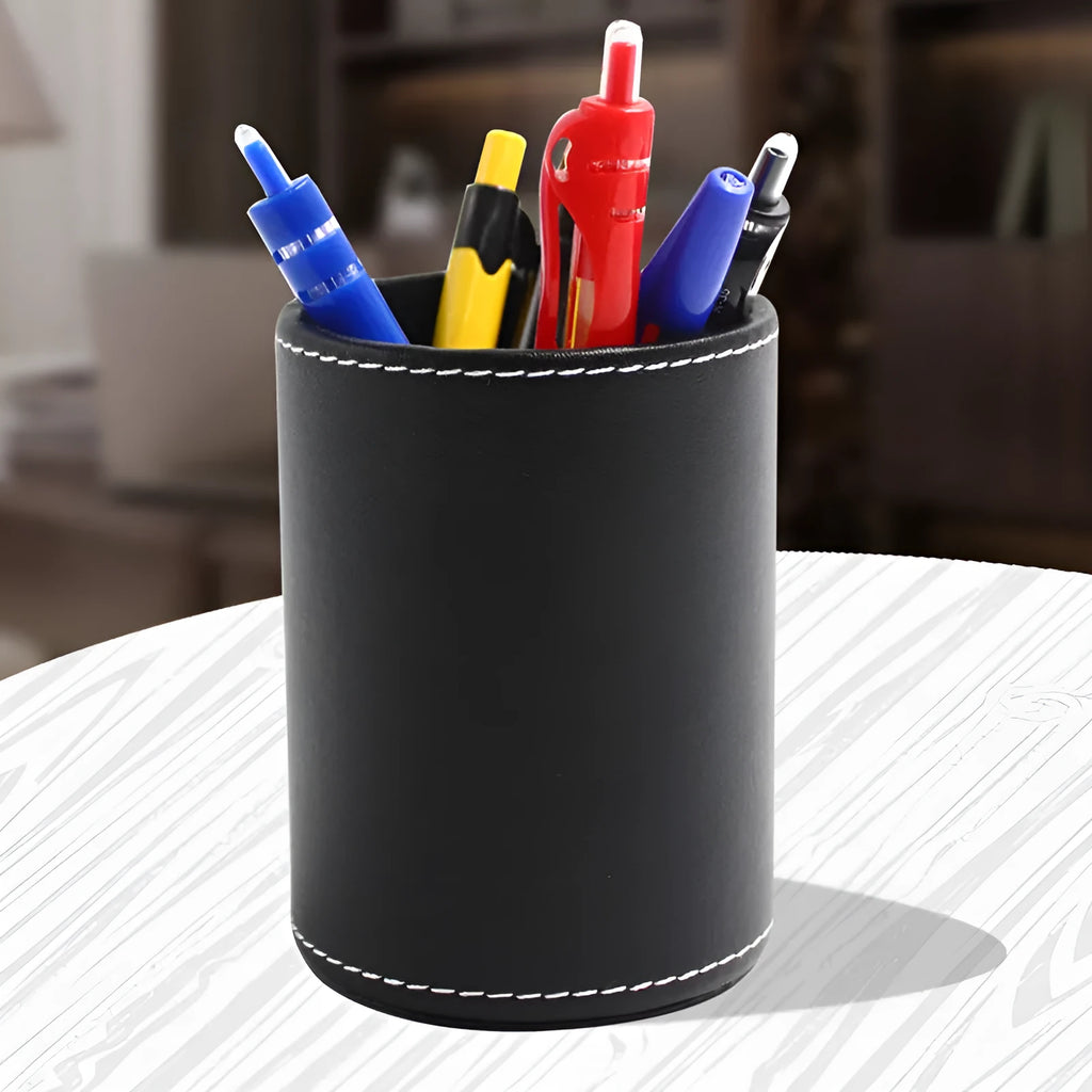 Round black leather pen holder with 8.0cm diameter on desk