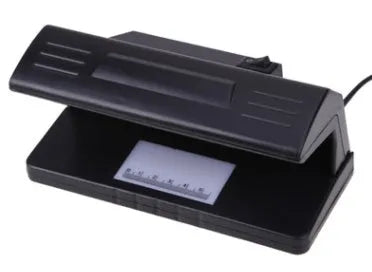 Black 4W UV light money detector checker with EU plug on a desk