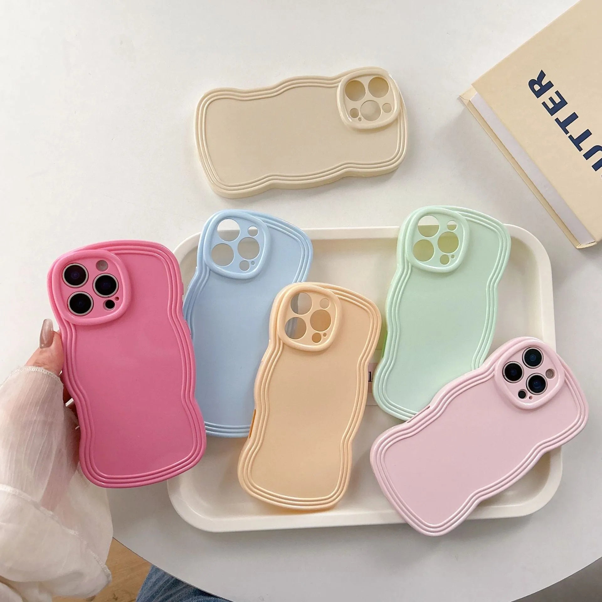 Wave pattern iPhone case in cream candy colour showing TPU material and anti-fingerprint surface