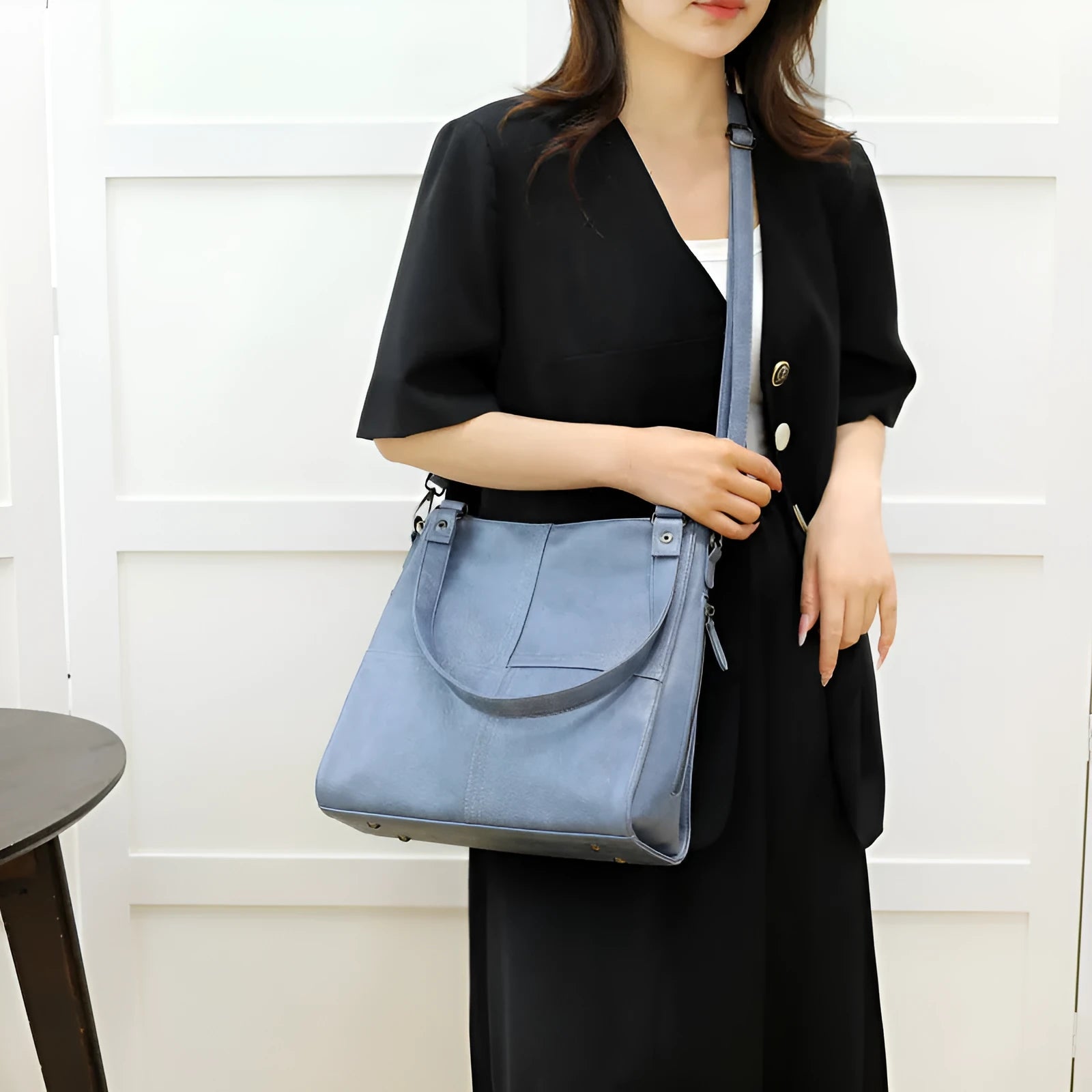 Soft PU retro style crossbody handbag in barrel shape showing pocket sandwich design.