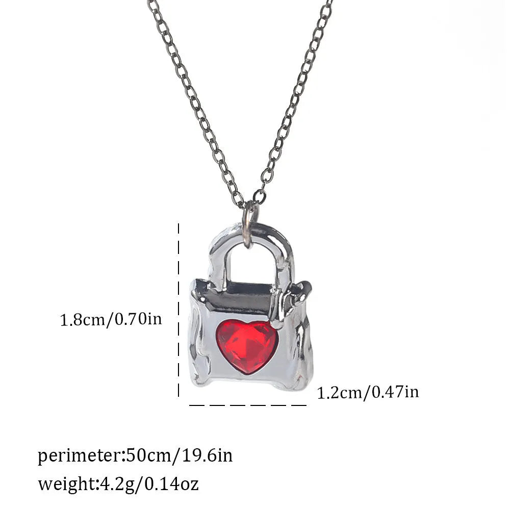 Silver electroplated gothic Halloween necklace with bat and spider pendant designs on a chain.