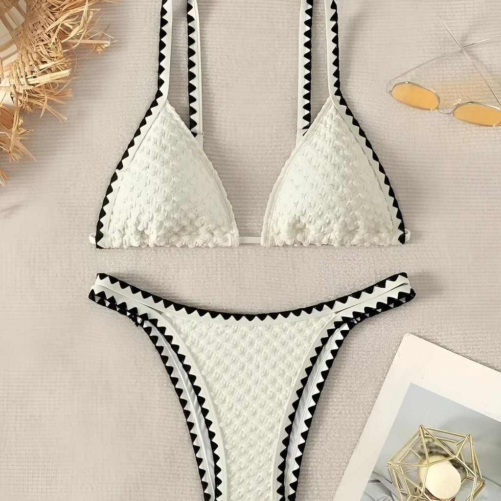 Women's two-piece split bikini swimsuit in white and blue colours with brief-style cut