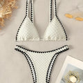Women's two-piece split bikini swimsuit in white and blue colours with brief-style cut