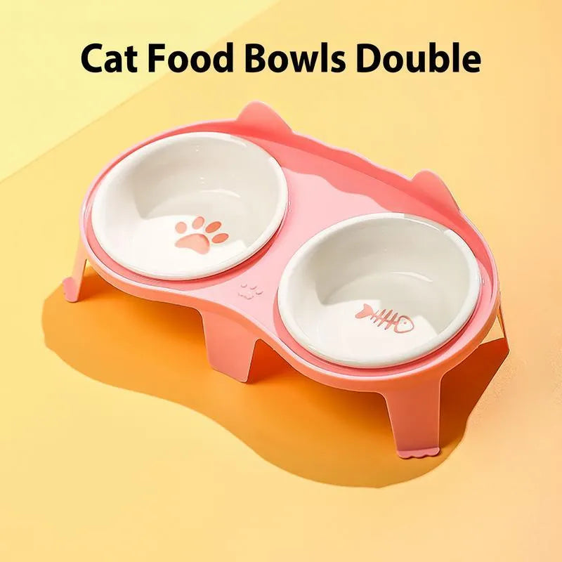 Blue ceramic cat food and water bowls in a white elevated plastic stand with a hook.